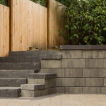 stone steps and retaining wall in backyard