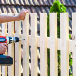 Man repairing fence